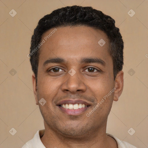 Joyful latino young-adult male with short  black hair and brown eyes