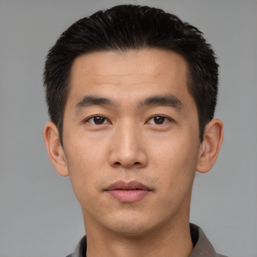 Neutral asian young-adult male with short  black hair and brown eyes