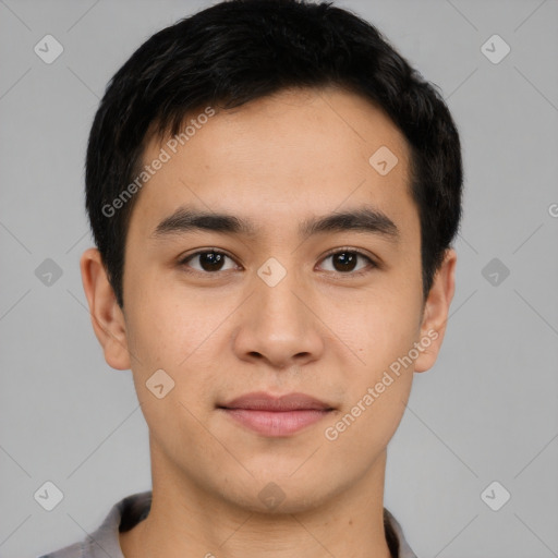 Joyful asian young-adult male with short  brown hair and brown eyes