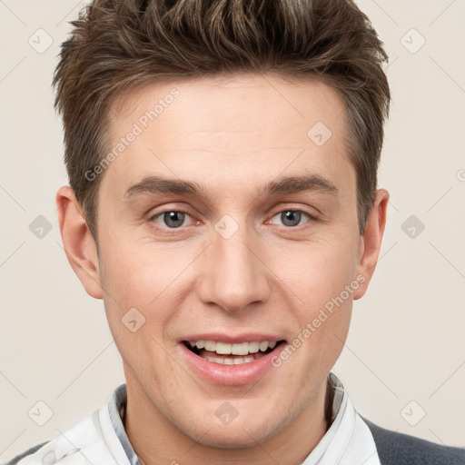 Joyful white adult male with short  brown hair and grey eyes