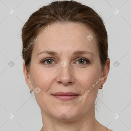 Joyful white adult female with short  brown hair and grey eyes