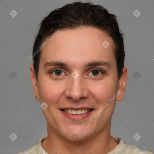 Joyful white young-adult male with short  brown hair and grey eyes