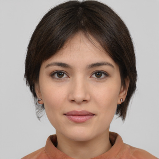 Joyful white young-adult female with medium  brown hair and brown eyes