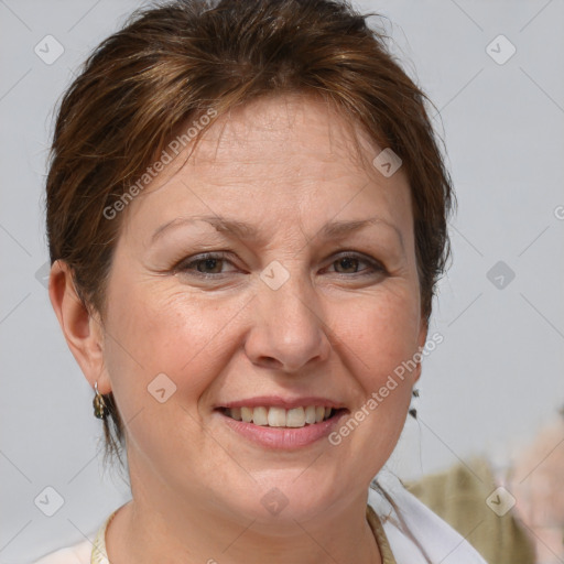 Joyful white adult female with short  brown hair and brown eyes