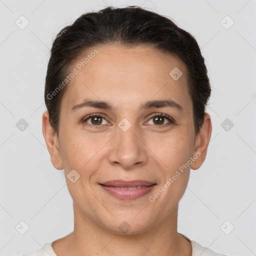 Joyful white adult female with short  brown hair and brown eyes