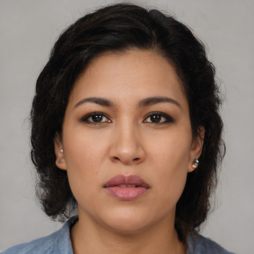 Neutral latino young-adult female with medium  brown hair and brown eyes