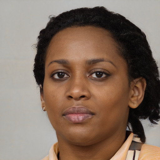 Neutral black young-adult female with medium  black hair and brown eyes