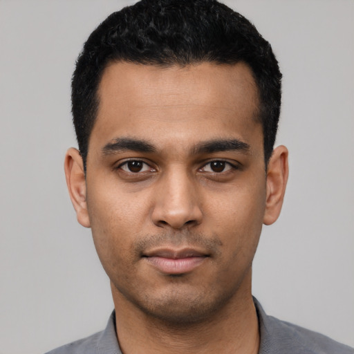 Neutral latino young-adult male with short  black hair and brown eyes