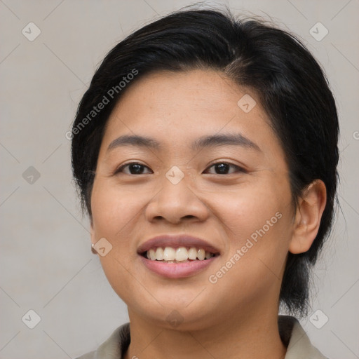 Joyful asian young-adult female with medium  black hair and brown eyes