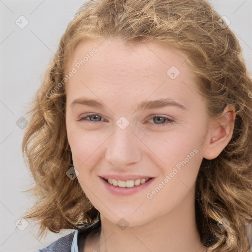 Joyful white child female with medium  brown hair and brown eyes