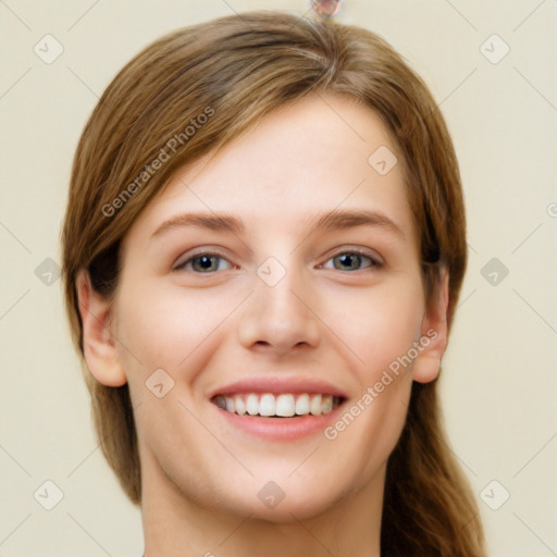 Joyful white young-adult female with short  brown hair and grey eyes