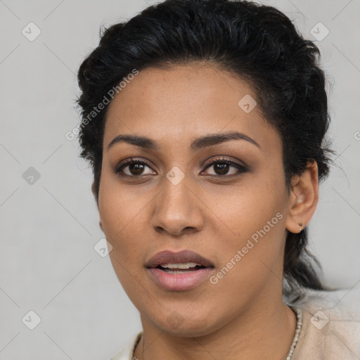 Joyful latino young-adult female with long  black hair and brown eyes