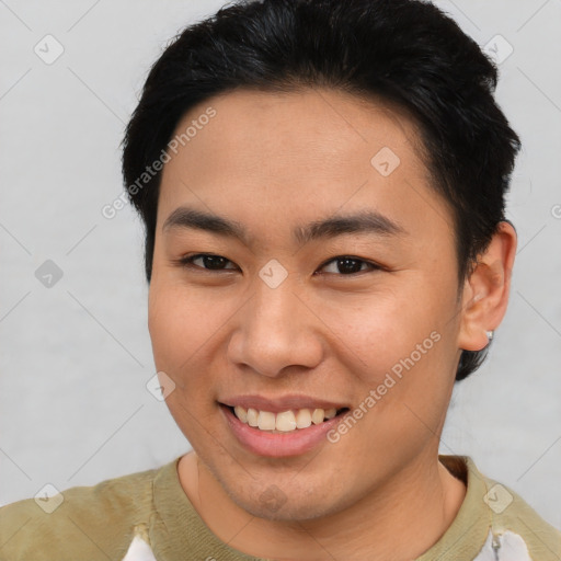 Joyful asian young-adult male with short  brown hair and brown eyes