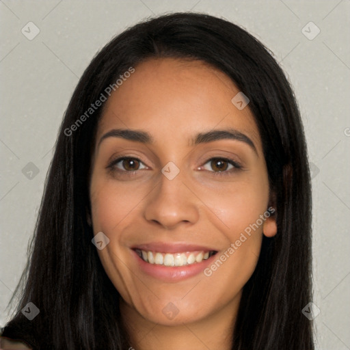 Joyful latino young-adult female with long  black hair and brown eyes