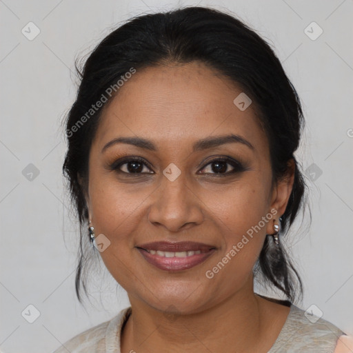 Joyful black adult female with medium  brown hair and brown eyes