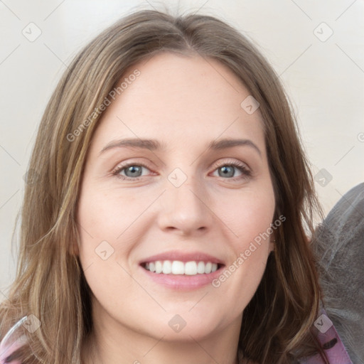 Joyful white young-adult female with long  brown hair and green eyes