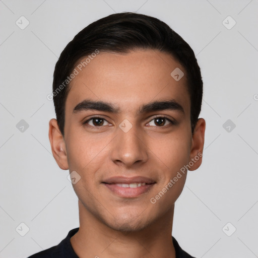 Joyful white young-adult male with short  black hair and brown eyes