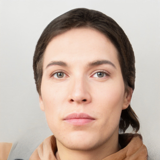 Neutral white young-adult female with short  brown hair and brown eyes