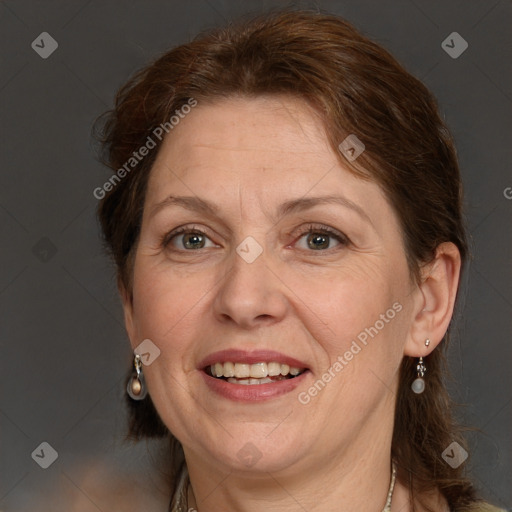 Joyful white adult female with medium  brown hair and green eyes