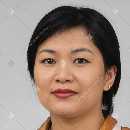 Joyful asian young-adult female with medium  black hair and brown eyes