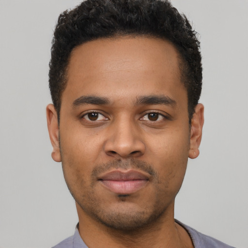 Neutral latino young-adult male with short  brown hair and brown eyes