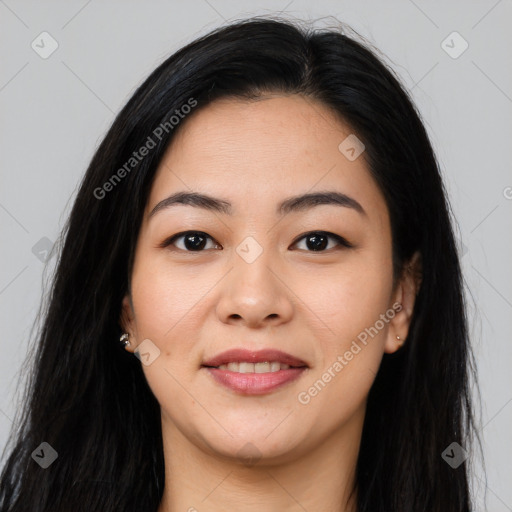 Joyful asian young-adult female with long  black hair and brown eyes