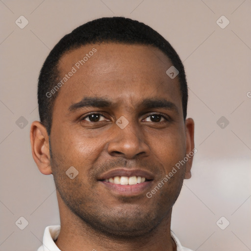 Joyful black young-adult male with short  brown hair and brown eyes