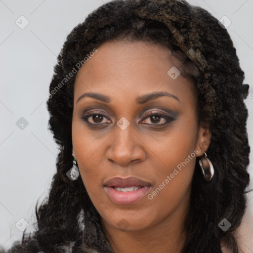 Joyful black young-adult female with long  brown hair and brown eyes