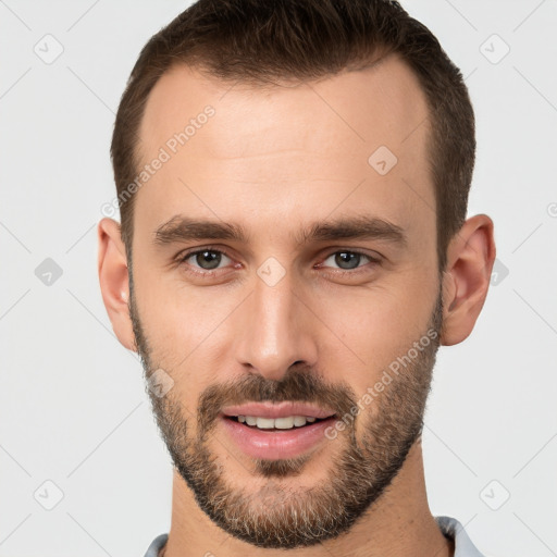 Joyful white young-adult male with short  brown hair and brown eyes