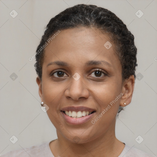 Joyful latino young-adult female with short  brown hair and brown eyes