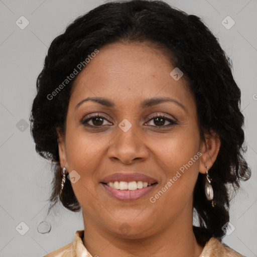 Joyful black adult female with medium  brown hair and brown eyes