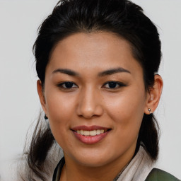 Joyful asian young-adult female with long  brown hair and brown eyes