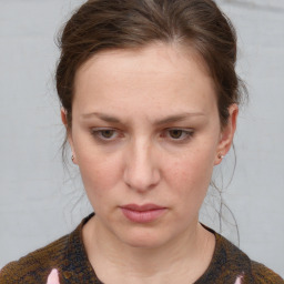 Neutral white young-adult female with medium  brown hair and grey eyes