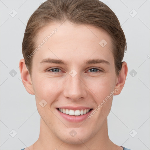 Joyful white young-adult female with short  brown hair and grey eyes