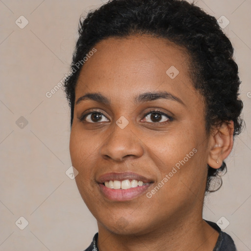 Joyful black young-adult female with short  black hair and brown eyes