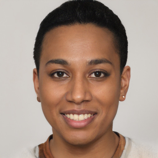 Joyful latino young-adult female with short  black hair and brown eyes