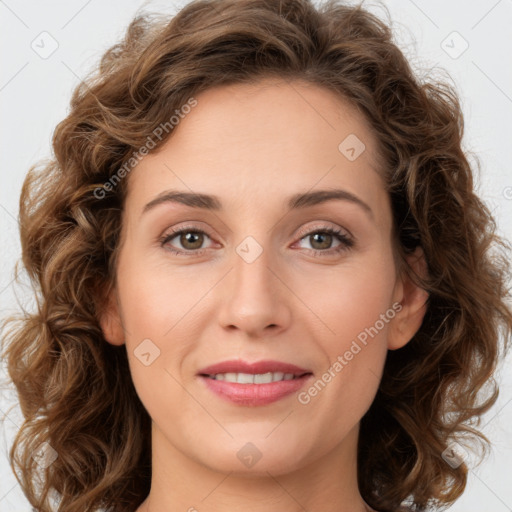 Joyful white young-adult female with long  brown hair and green eyes