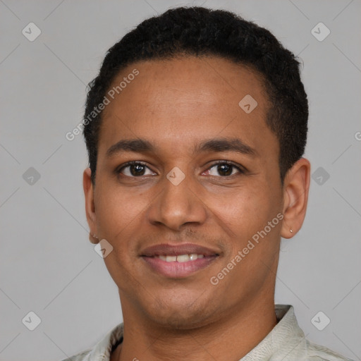 Joyful latino young-adult male with short  brown hair and brown eyes