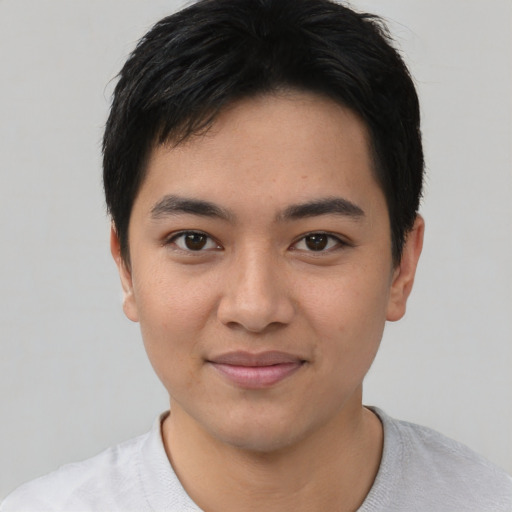 Joyful asian young-adult male with short  black hair and brown eyes