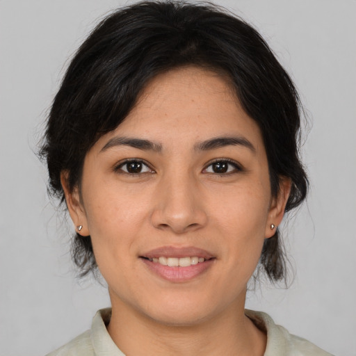 Joyful asian young-adult female with medium  brown hair and brown eyes