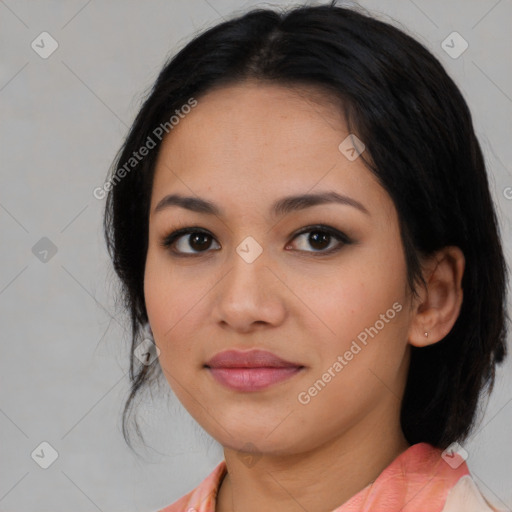 Joyful asian young-adult female with medium  black hair and brown eyes