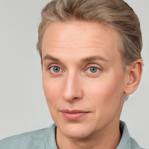 Joyful white adult male with short  brown hair and grey eyes