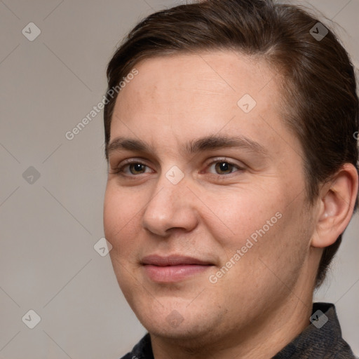 Joyful white adult male with short  brown hair and brown eyes