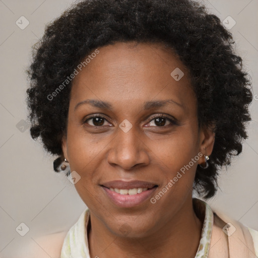 Joyful black adult female with short  brown hair and brown eyes