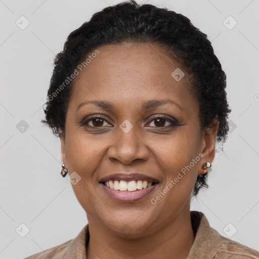 Joyful latino adult female with short  brown hair and brown eyes