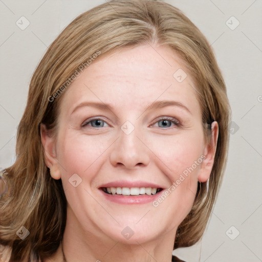 Joyful white young-adult female with medium  brown hair and blue eyes