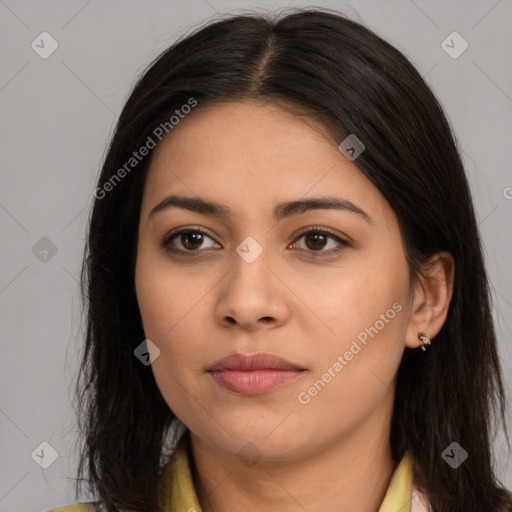 Joyful latino young-adult female with long  brown hair and brown eyes