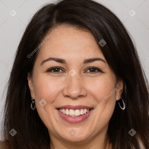 Joyful white adult female with long  brown hair and brown eyes