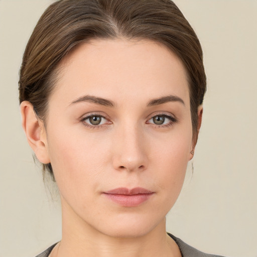 Neutral white young-adult female with short  brown hair and brown eyes