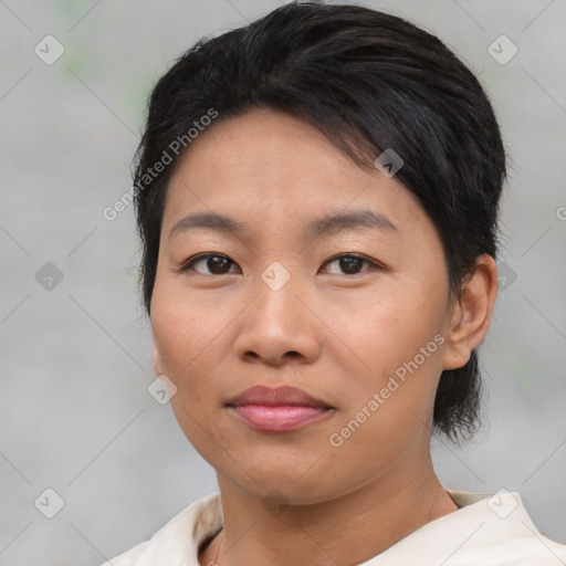 Joyful asian young-adult female with short  brown hair and brown eyes